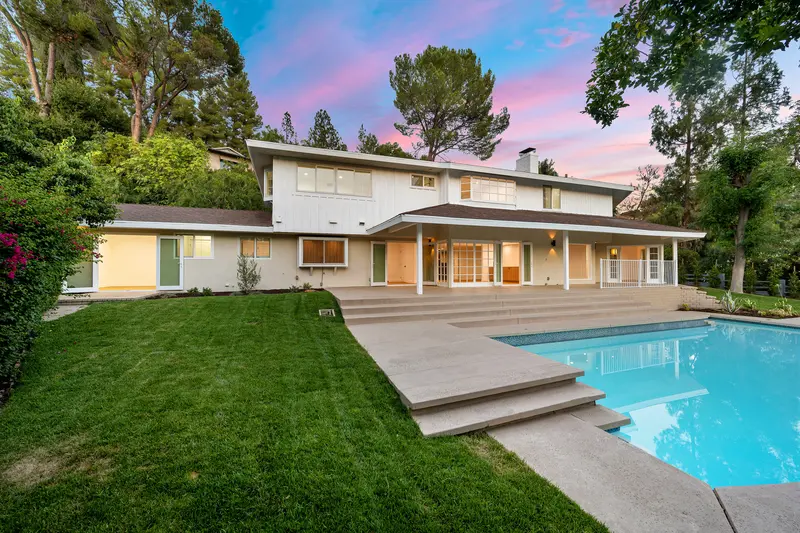 Exterior house painting and beautiful backyard pool area Exterior house painting and beautiful backyard pool area
