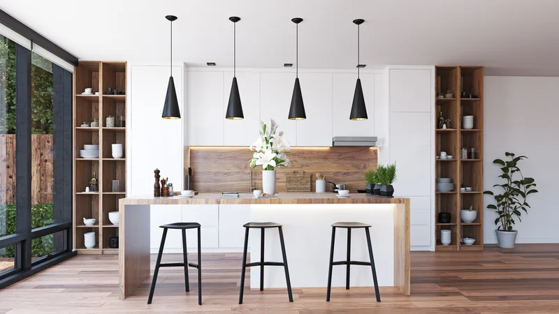 Modern white kitchen cabinets with wood backsplashes and black lights. Modern white kitchen cabinets with wood backsplashes and black lights.